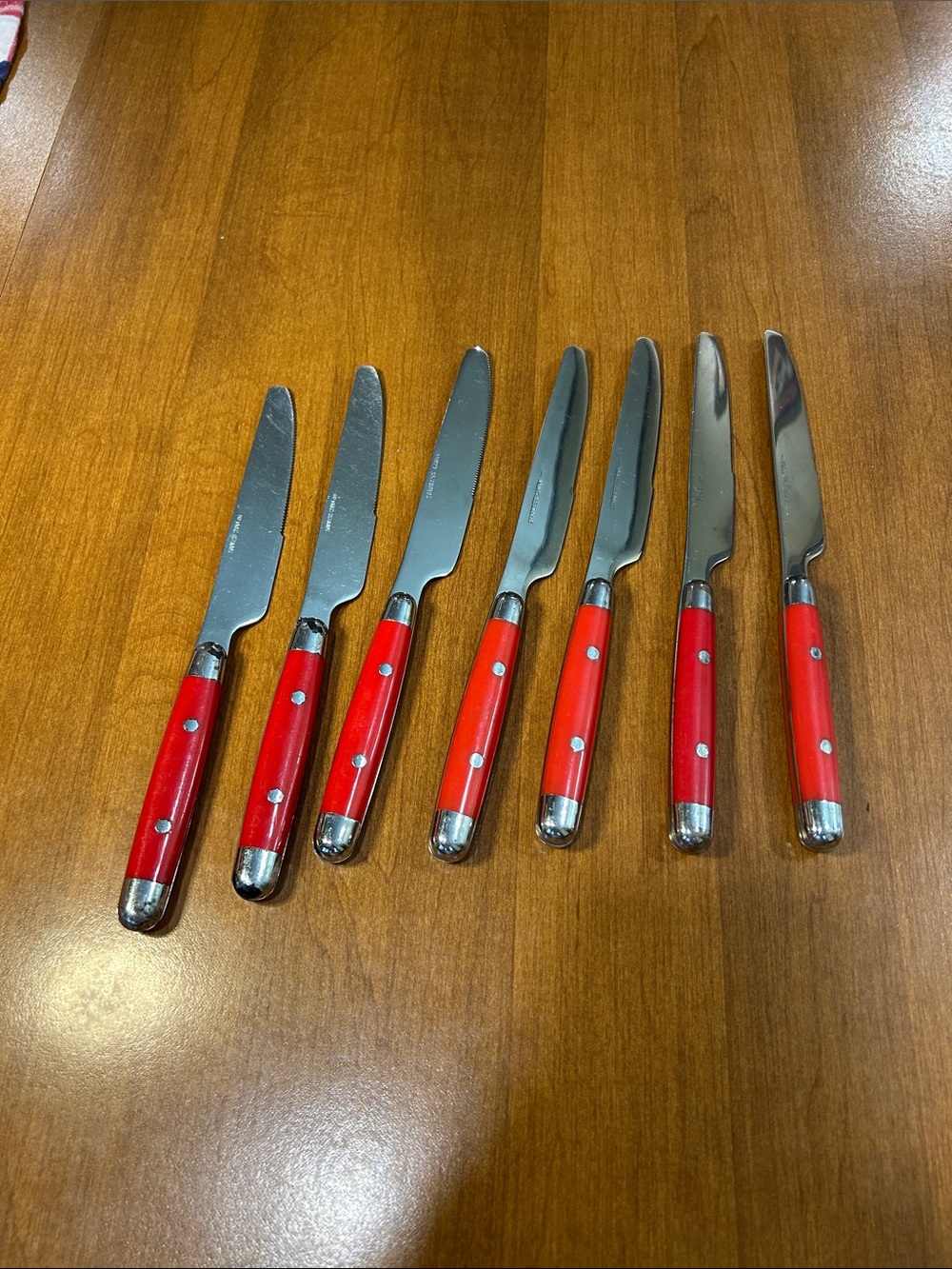 Set of 7 Red Handle Dinner Knives